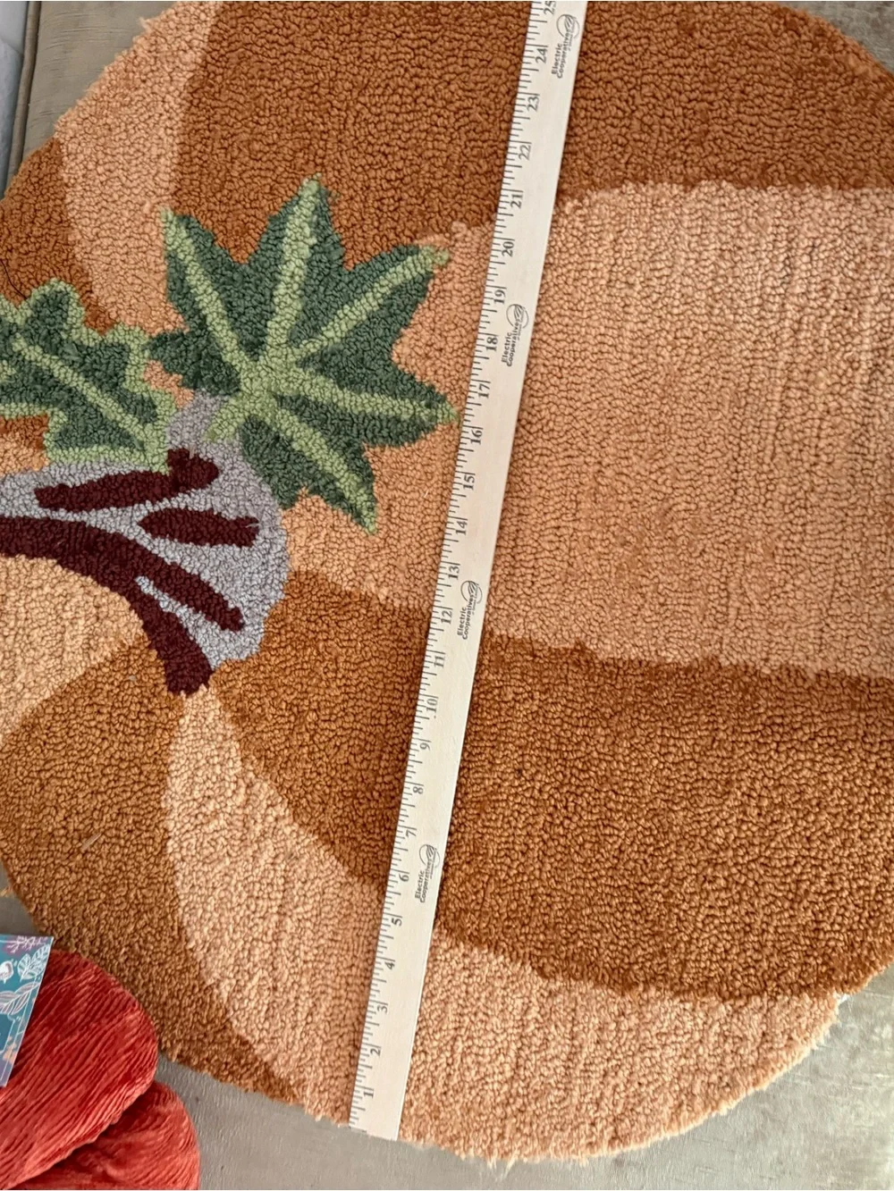 Autumn Pumpkin Accent thick and plush hooked Rug , and an orange cloth pumpkin.